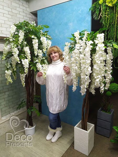 Decorative tree made of white artificial wisteria flowers. We make similar trees of any height under the order.
