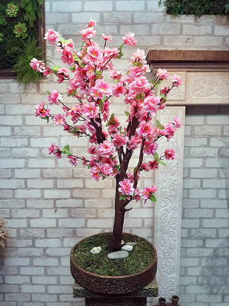 This exclusive handmade tree will attract attention and delight with its beautiful blooms, no matter the season.