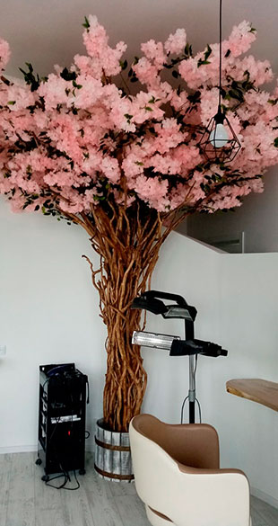 Tree from natural branches and pink flowers