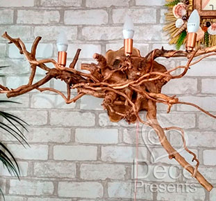 Buy a wall lamp made of tree roots for a summer restaurant